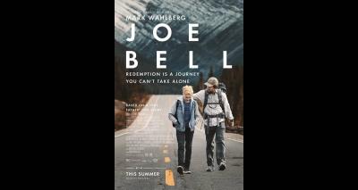 Movie poster shows man and son walking down an empty road with mountains in background; Text says "Mark Wahlberg; Joe Bell; Redemption is a journey you can't take alone."