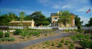 The exterior of the plantation house and slave quarters from the garden. 