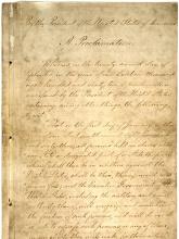 Photo of the original Emancipation Proclamation, script writing on parchment-style paper.