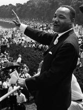 Dr. Martin Luther King Jr. waves to the crowd at the March on Washington in 1963.