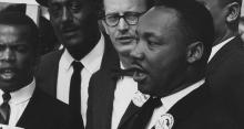 Dr. Martin Luther King, Jr., President of the Southern Christian Leadership Conference, and Mathew Ahmann, Executive Director of the National Catholic Conference for Interrracial Justice, in a crowd.