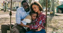  Bishop and Donna Martin hug their foster daughter, Teri, sitting on a swing.